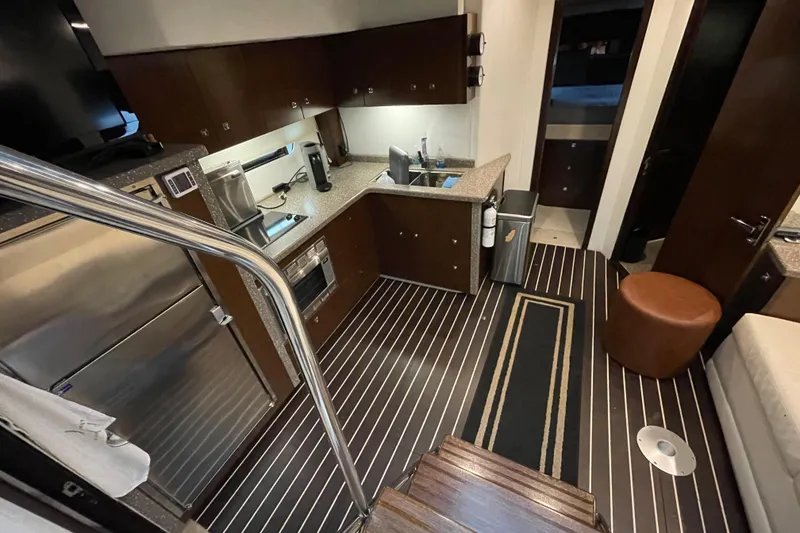 Slide: The Image of Control panel of a 2012 Cruisers Yachts 48 Cantius with navigation displays. - 37