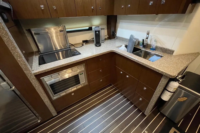 Slide: The Image of Luxurious interior of 2012 Cruisers Yachts 48 Cantius with helm, seating, and entertainment system. - 38