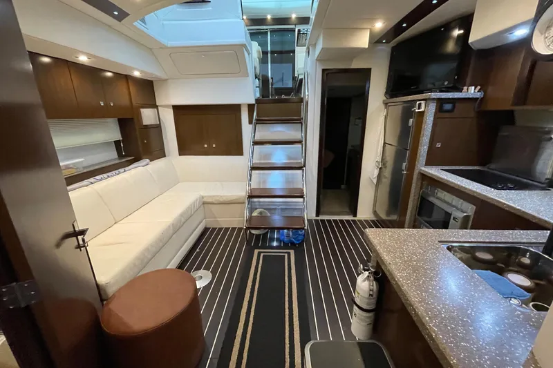 Slide: The Image of Luxurious interior of 2012 Cruisers Yachts 48 Cantius with modern kitchen and seating area. - 39