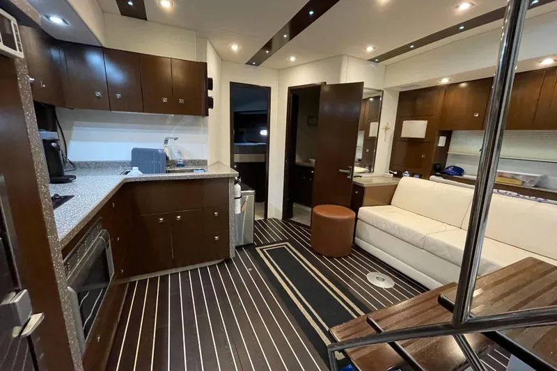 Slide: The Image of Luxurious interior of 2012 Cruisers Yachts 48 Cantius with white sofa and wooden accents. - 40