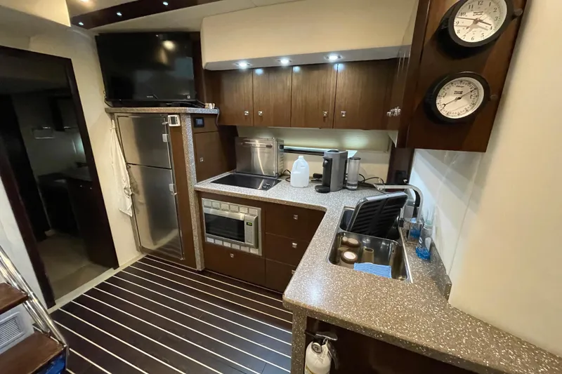 Slide: The Image of 2012 Cruisers Yachts 48 Cantius kitchen with modern appliances and sleek countertops. - 42