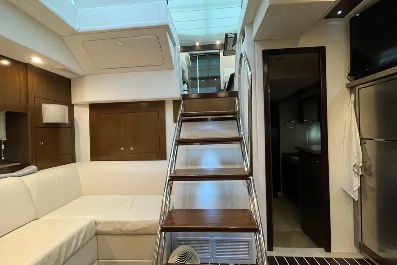 Slide: The Image of Luxurious interior of 2012 Cruisers Yachts 48 Cantius with modern kitchen and seating area. - 43