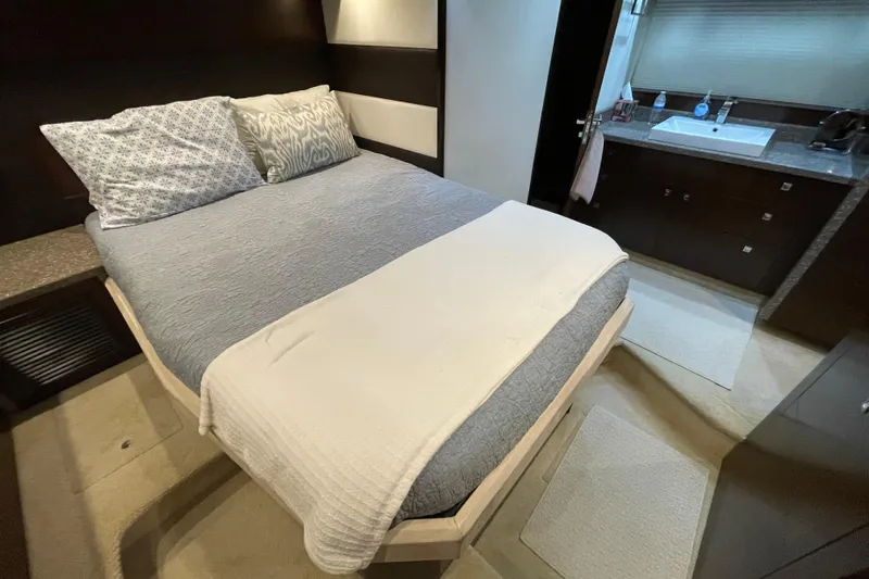 Slide: The Image of Luxurious interior of 2012 Cruisers Yachts 48 Cantius with white sofa and wooden cabinetry. - 45