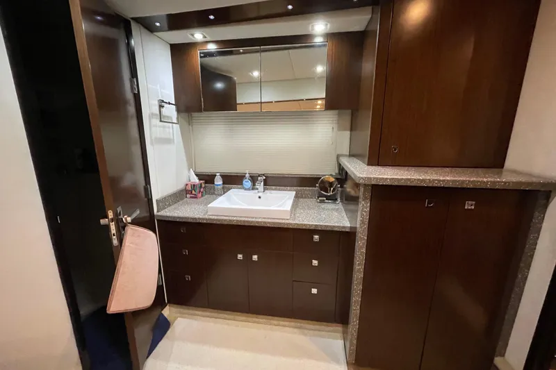 Slide: The Image of Luxurious bedroom interior of 2012 Cruisers Yachts 48 Cantius with elegant bedding and ambient lighting. - 48