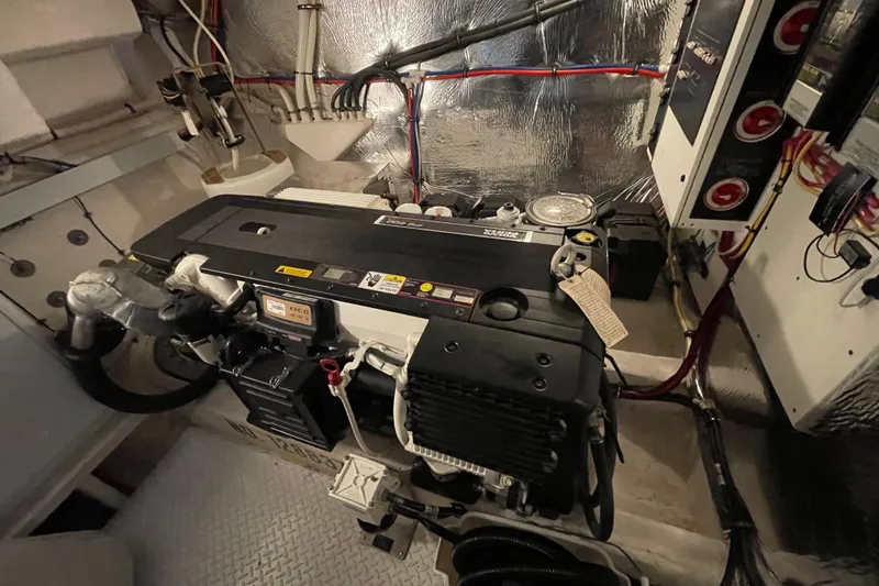 Slide: The Image of Luxurious 2012 Cruisers Yachts 48 Cantius bedroom with elegant bedding and ambient lighting. - 58