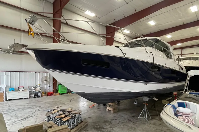 Slide: The Image of 2012 Cruisers Yachts 48 Cantius in indoor storage, showcasing sleek design and modern features. - 72