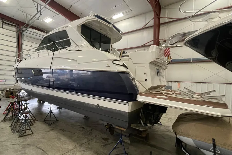 Slide: The Image of 2012 Cruisers Yachts 48 Cantius in a boat storage facility, side view. - 74