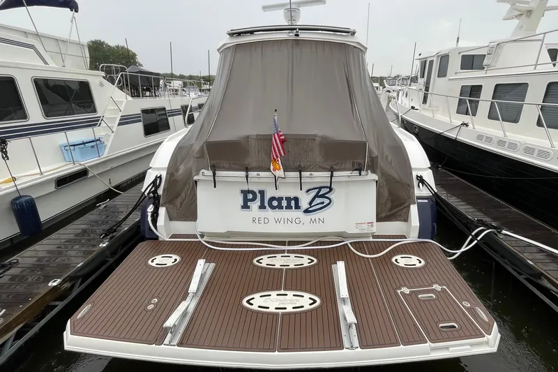 Slide: The Image of 2012 Cruisers Yachts 48 Cantius docked, rear view with "Plan B" name, Red Wing, MN. - 8