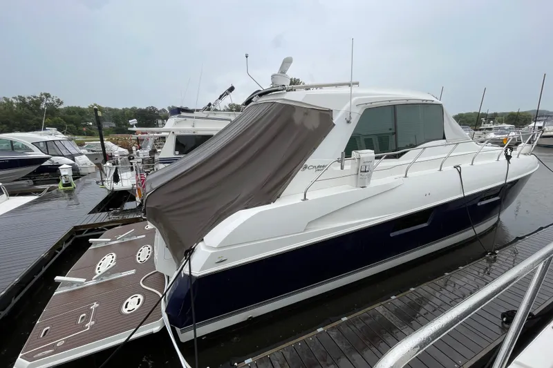 Slide: The Image of 2012 Cruisers Yachts 48 Cantius docked at marina, side view. - 9
