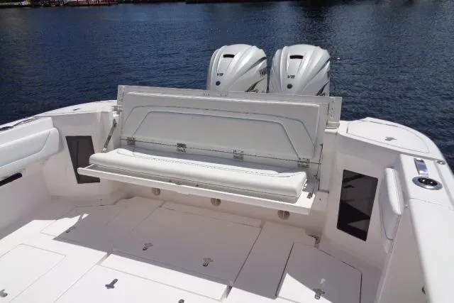 Slide: The Image of 2020 Intrepid 345 Nomad FE boat with dual engines and foldable seating. - 13