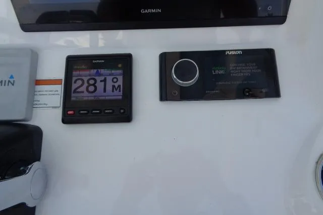 Slide: The Image of Control panel of a 2020 Intrepid 345 Nomad FE with Garmin and Fusion displays. - 17