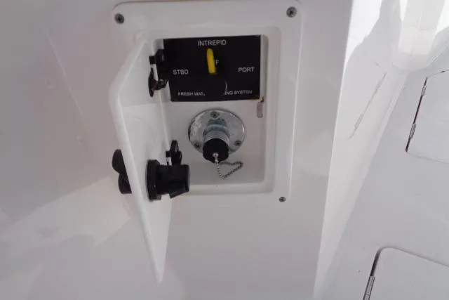 Slide: The Image of Control panel of a 2020 Intrepid 345 Nomad FE boat, featuring switches and connectors. - 22