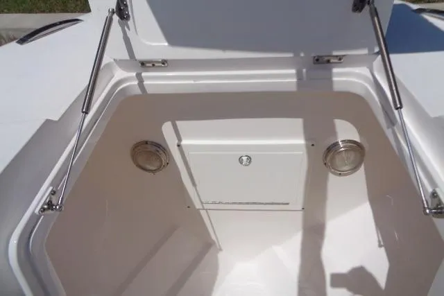 Slide: The Image of Open storage compartment on a 2020 Intrepid 345 Nomad FE boat. - 23