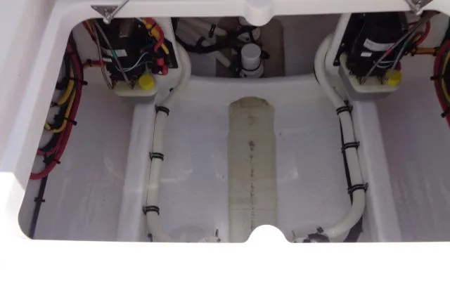 Slide: The Image of 2020 Intrepid 345 Nomad FE boat interior with visible wiring and components. - 26