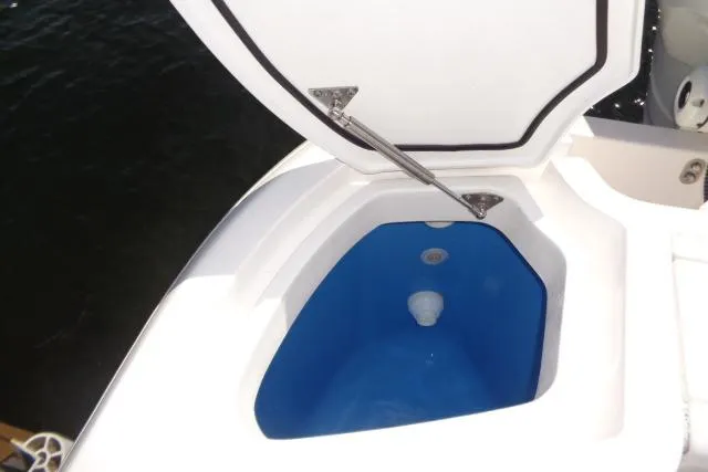 Slide: The Image of Open storage compartment on 2020 Intrepid 345 Nomad FE boat. - 28