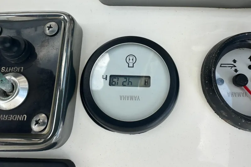 Slide: The Image of Yamaha hour meter on 2019 NauticStar 2302 Legacy boat dashboard, showing 612 hours. - 3