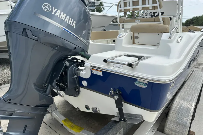Slide: The Image of 2019 NauticStar 2302 Legacy boat with Yamaha outboard motor on trailer. - 9