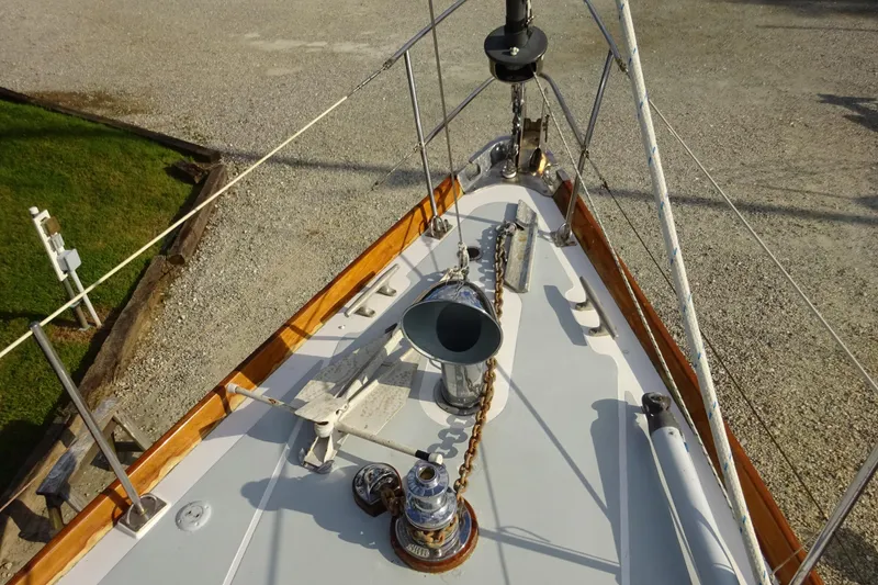 Slide: The Image of Bow view of 1970 Hinckley Bermuda 40 Custom sailboat with anchor and deck fittings. - 17