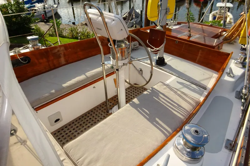 Slide: The Image of Cockpit of 1970 Hinckley Bermuda 40 Custom sailboat with wooden trim and steering wheel. - 29