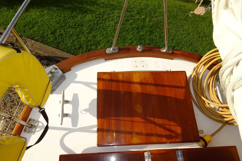Slide: The Image of 1970 Hinckley Bermuda 40 Custom sailboat deck with wooden hatch and yellow life preserver. - 31