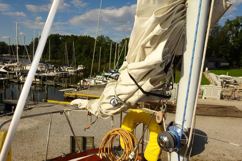 Slide: The Image of 1970 Hinckley Bermuda 40 Custom sailboat docked at marina with folded sails. - 33