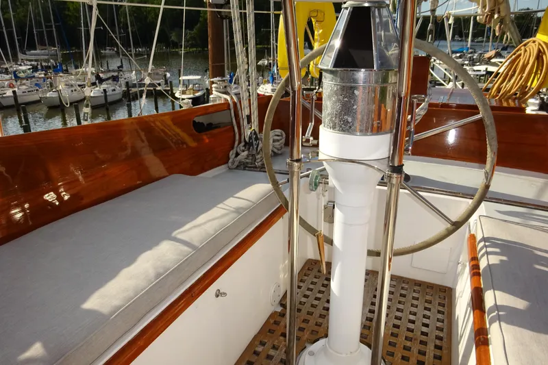 Slide: The Image of Cockpit of 1970 Hinckley Bermuda 40 Custom sailboat with wooden accents and steering wheel. - 39