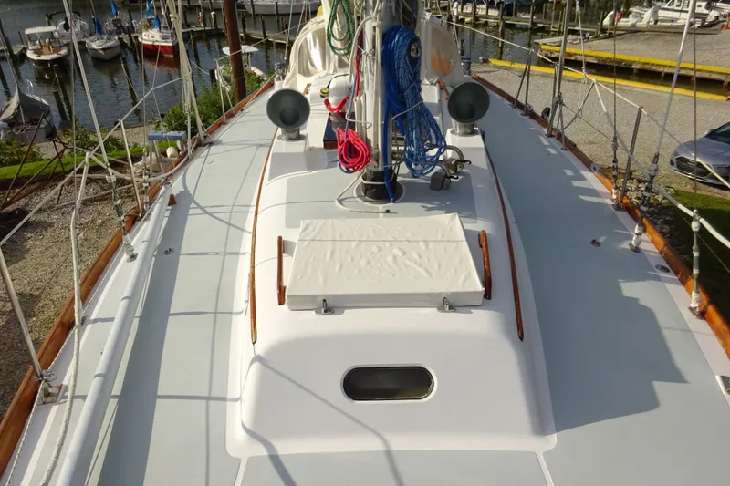 Slide: The Image of Deck view of 1970 Hinckley Bermuda 40 Custom sailboat at marina. - 9