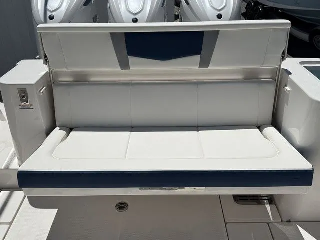 Slide: The Image of 2026 Robalo R360 Center Console boat seat, white and blue upholstery. - 12
