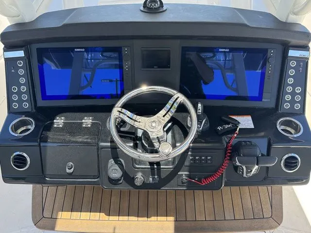 Slide: The Image of 2026 Robalo R360 Center Console dashboard with dual screens and modern controls. - 13