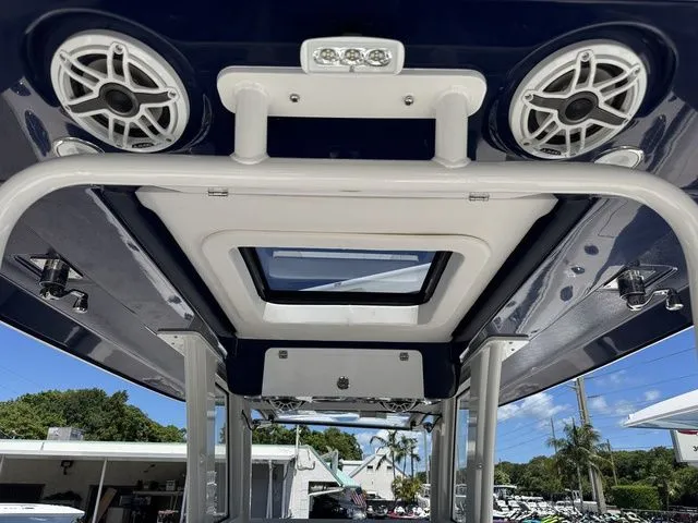 Slide: The Image of 2026 Robalo R360 Center Console boat roof with speakers and skylight. - 22