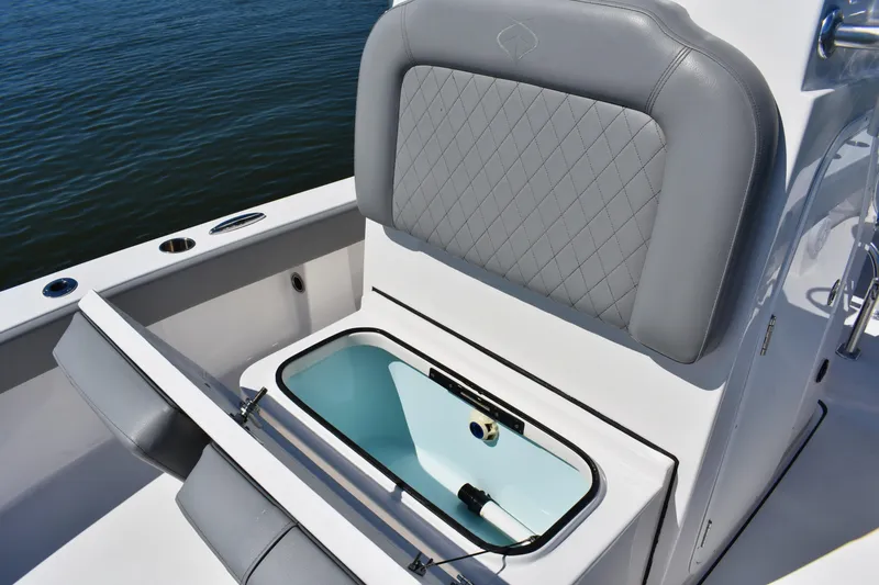 Slide: The Image of 2023 Xplor X24 boat interior with open storage compartment and speaker. - 11