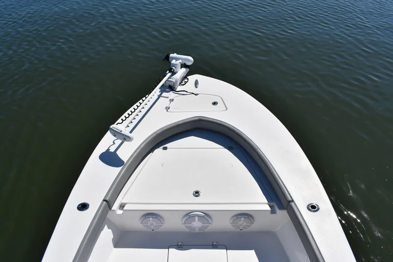 Slide: The Image of Luxury seating on 2023 Xplor X24 boat with scenic water backdrop. - 17