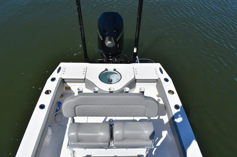 Slide: The Image of 2023 Xplor X24 boat on calm water, featuring sleek design and modern amenities. - 18