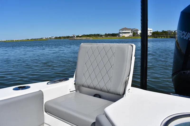 Slide: The Image of Bow of 2023 Xplor X24 boat with trolling motor on calm water. - 19