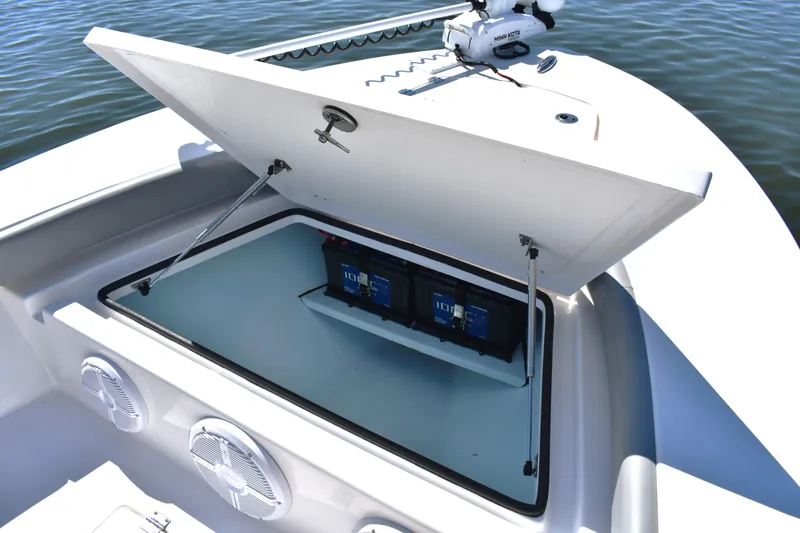 Slide: The Image of 2023 Xplor X24 boat cruising at sunset on a calm lake. - 8