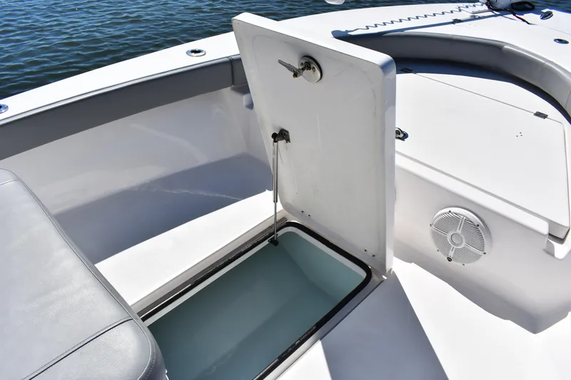 Slide: The Image of 2023 Xplor X24 boat on calm water, featuring sleek seating and modern design. - 9