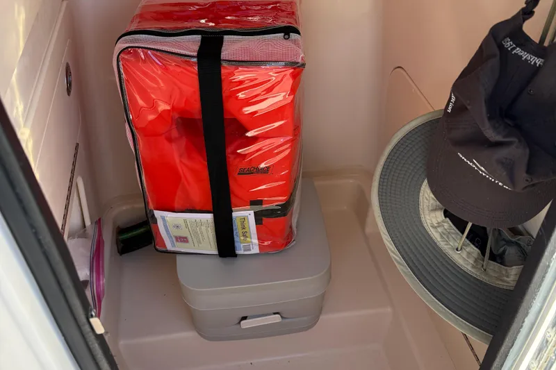 Slide: The Image of 2024 Grady-White Fisherman 216 boat interior with cushioned seating and speakers. - 10