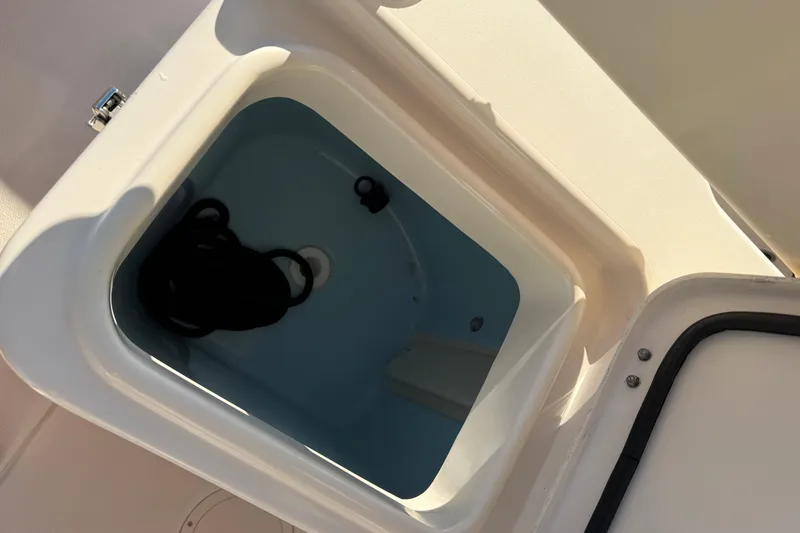 Slide: The Image of 2024 Grady-White Fisherman 216 boat storage compartment with rope inside. - 11