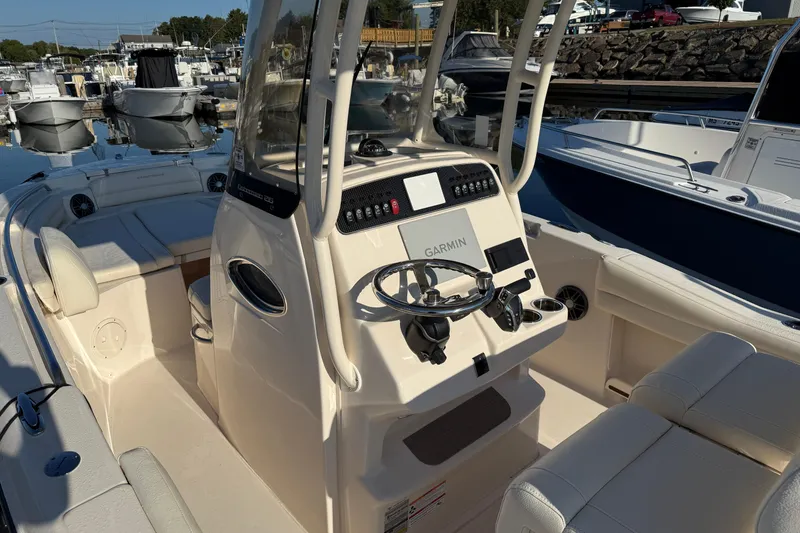 Slide: The Image of 2024 Grady-White Fisherman 216 boat docked at marina, rear view. - 5