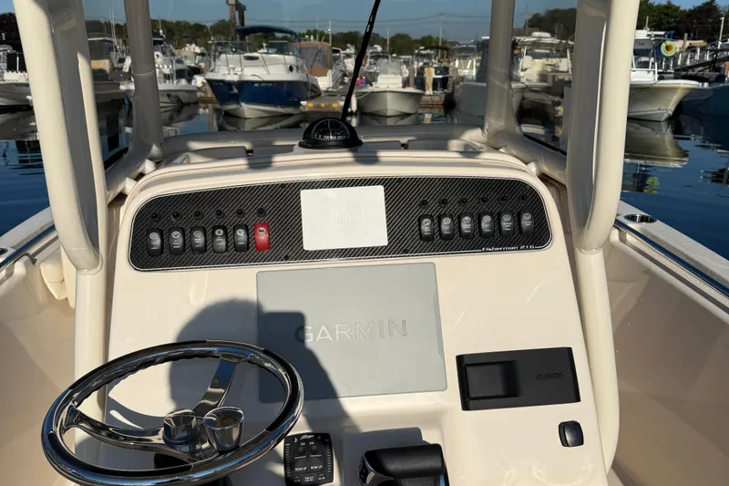 Slide: The Image of 2024 Grady-White Fisherman 216 storage area with life jackets and accessories. - 9