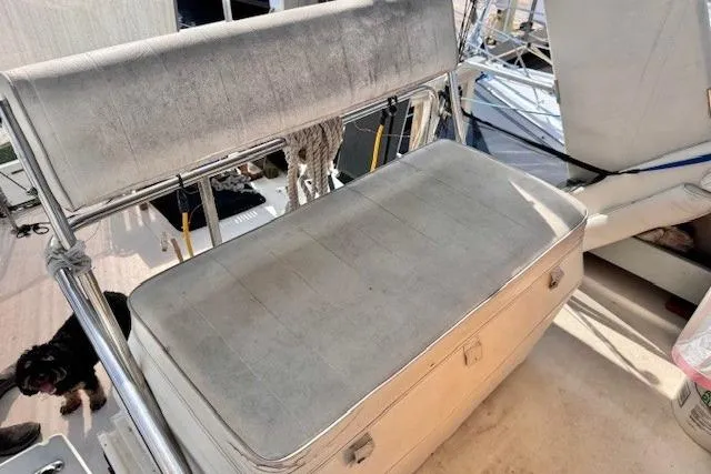 Slide: The Image of 1985 Silverton 40 ACMY boat seat with metal frame and storage underneath. - 23