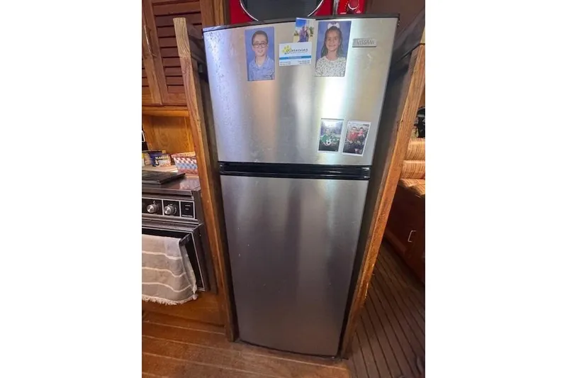 Slide: The Image of Stainless steel refrigerator inside 1985 Silverton 40 ACMY yacht kitchen. - 43
