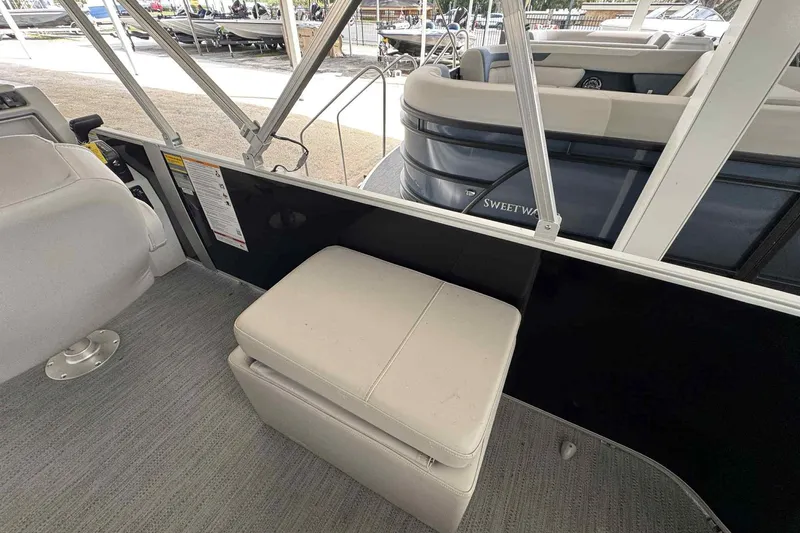 Slide: The Image of 2026 Sweetwater 2086FX boat interior with cushioned seating and sleek design. - 4