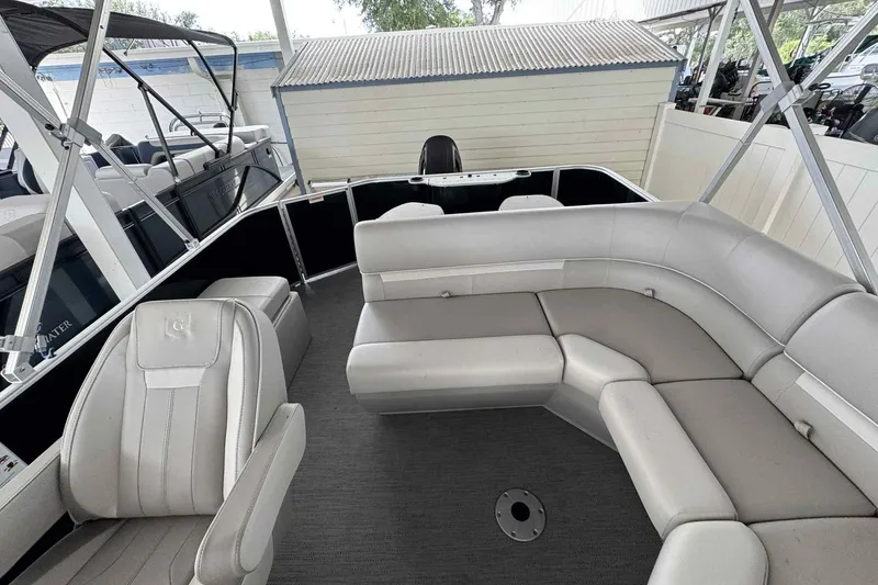 Slide: The Image of Interior of 2026 Sweetwater 2086FX pontoon boat with gray seating and spacious layout. - 8