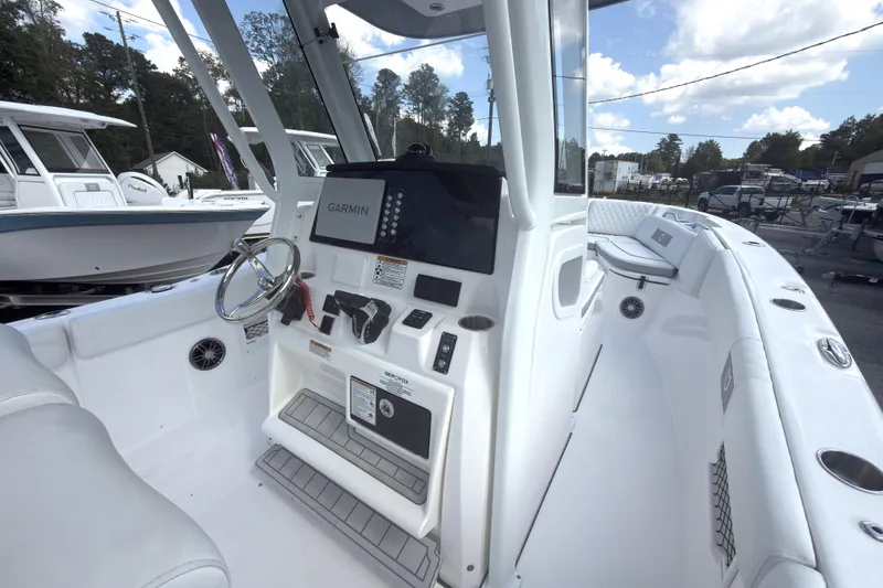 Slide: The Image of 2026 Sea Fox 268 Commander boat interior with Garmin navigation system and seating. - 5