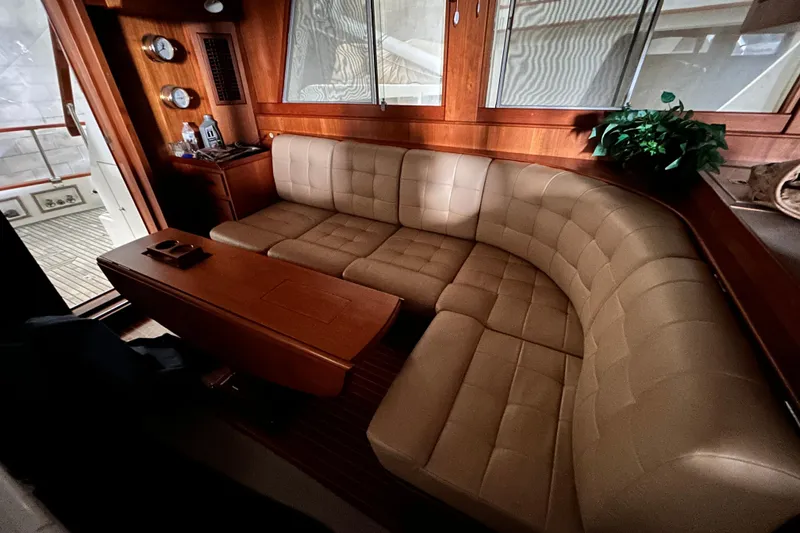 Slide: The Image of Luxurious interior of 1999 Grand Banks 46 Europa yacht with plush seating and wooden accents. - 10