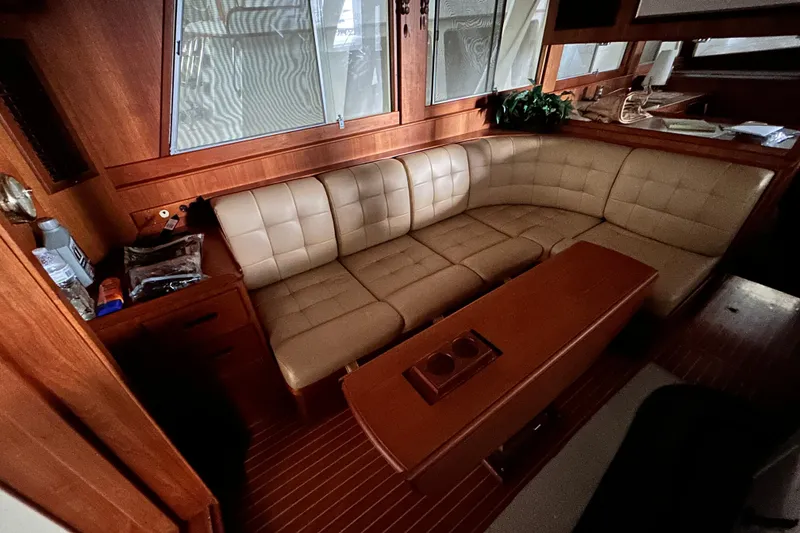 Slide: The Image of Luxurious interior of 1999 Grand Banks 46 Europa yacht with beige leather seating. - 11