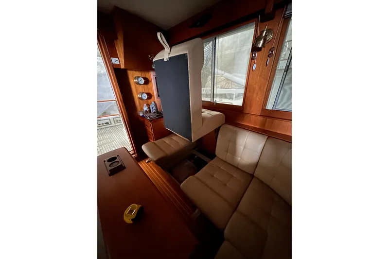 Slide: The Image of Interior of 1999 Grand Banks 46 Europa yacht with leather seating and wooden accents. - 12