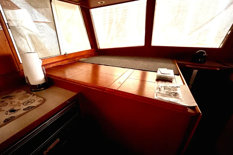 Slide: The Image of Interior of 1999 Grand Banks 46 Europa yacht with wooden cabinetry and large windows. - 16