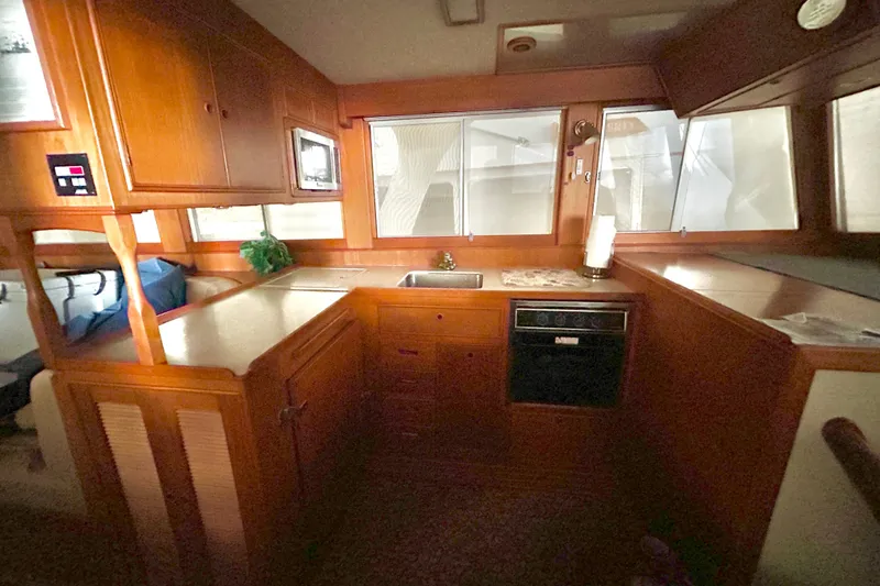 Slide: The Image of Cozy wooden kitchen interior of 1999 Grand Banks 46 Europa yacht. - 17